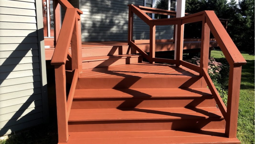 Newly painted and refinished stairs and deck